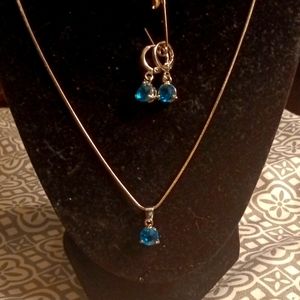 Sweet sapphire colored stone earring and necklace set in silver.